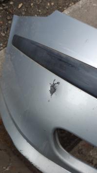 Grijze voorbumper Saab 95 uit 2004